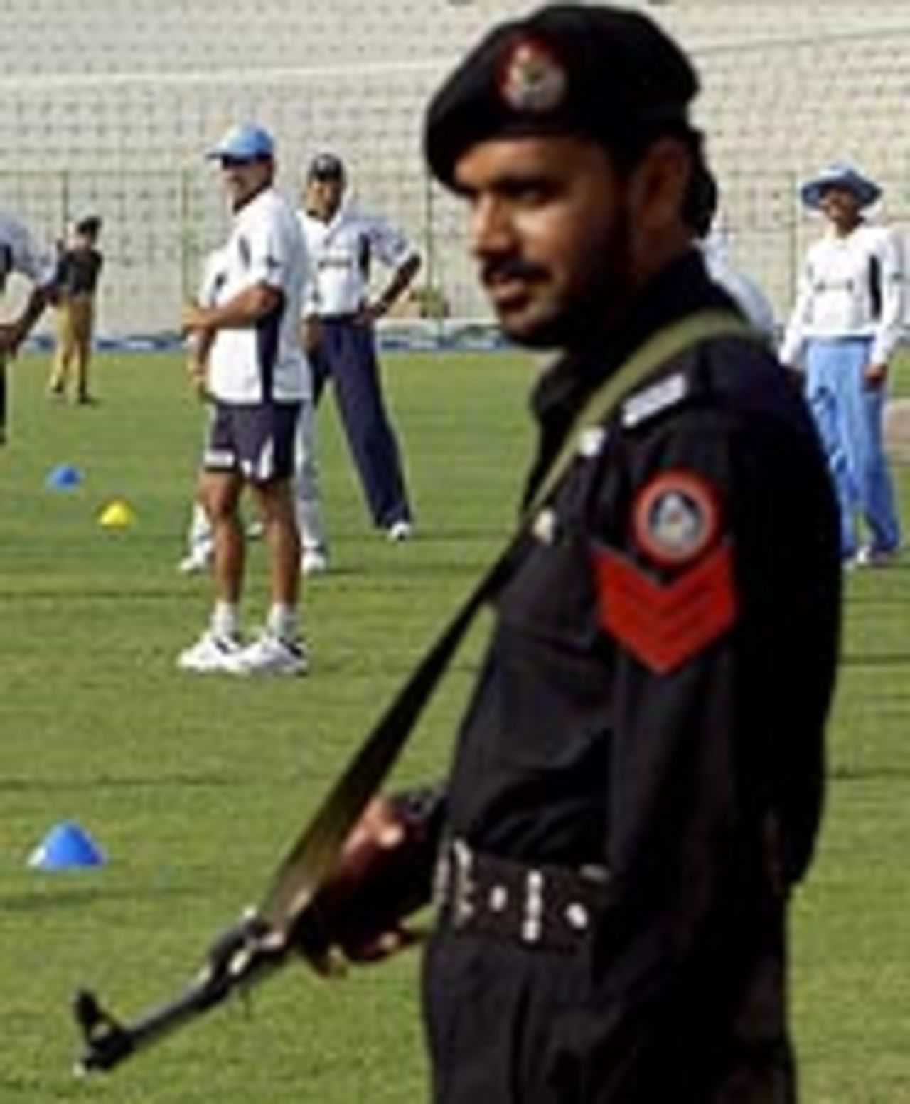 A Pakistani policeman guards the Indian team, Peshawar, March 19, 2003