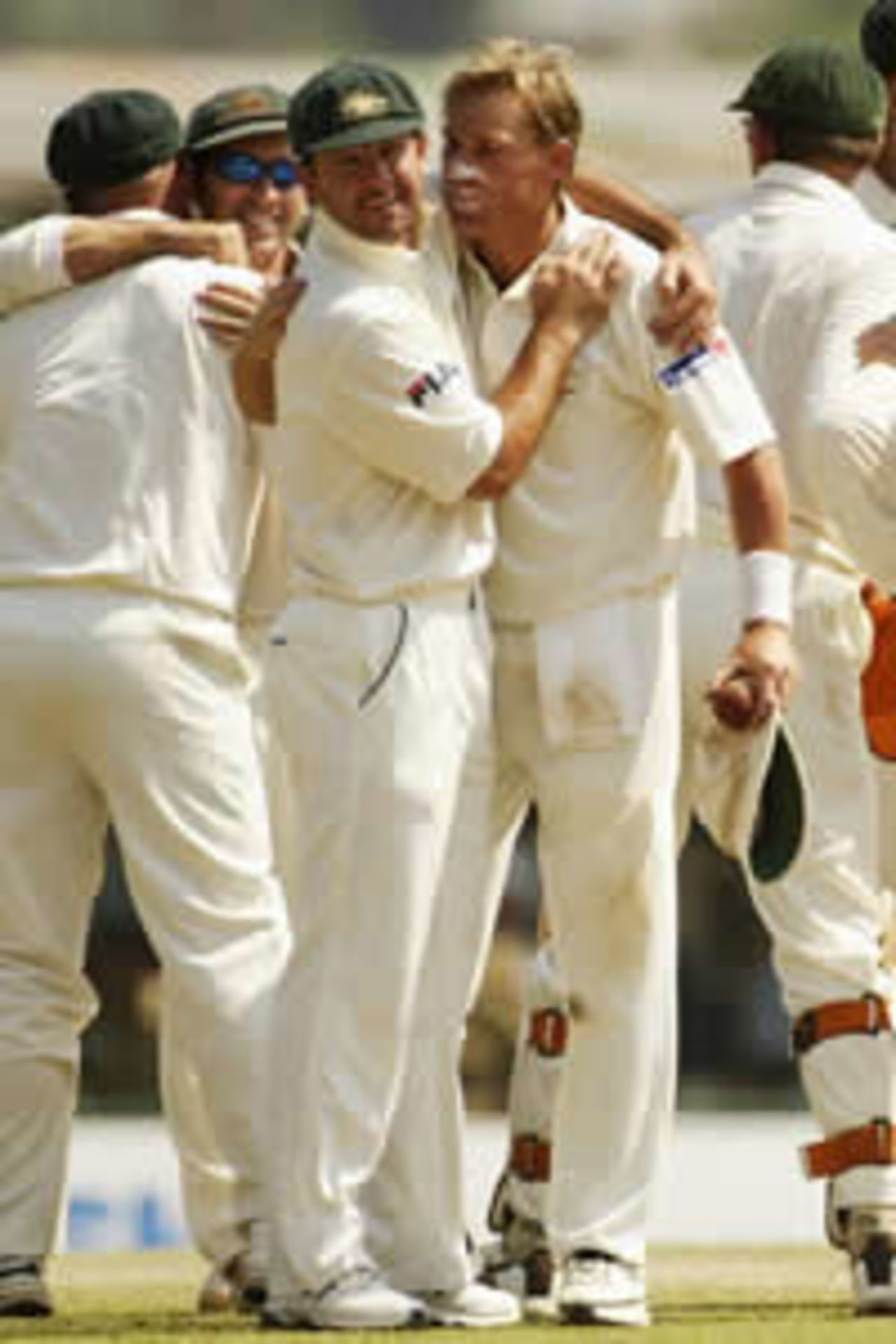 Ricky Ponting congratulates Shane Warne on an excellent bowling effort that helped Australia win its first series in Sri Lanka for many years