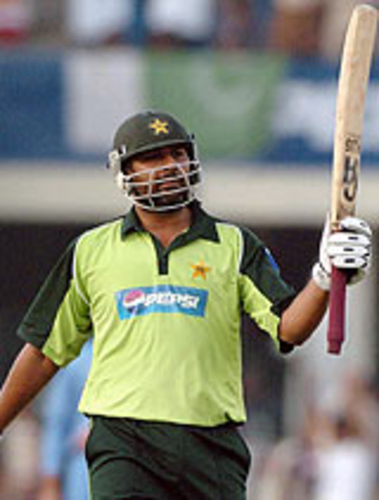Inzamam-ul-Haq raises his bat after his century, Pakistan v India, 4th ODI, Lahore, March 21, 2004
