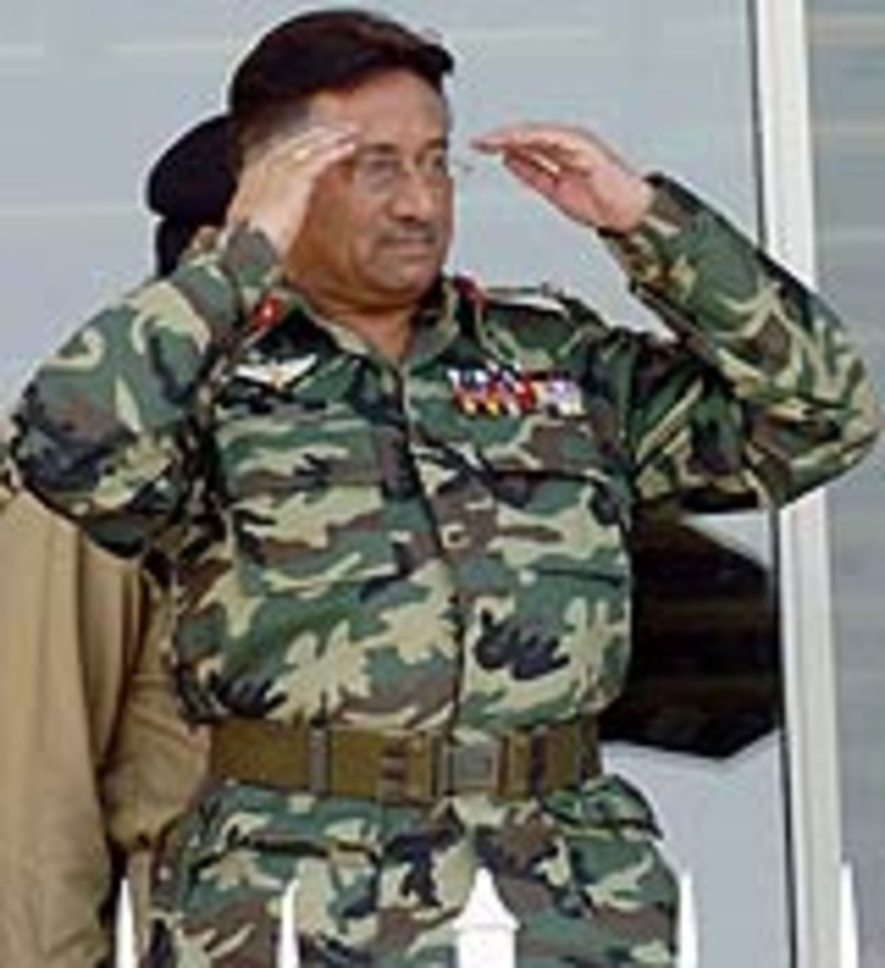 Pakistan's president, Pervez Musharraf, gestures to the crowd during the deciding ODI at Lahore, Pakistan v India, 5th ODI, Lahore, March 24, 2004