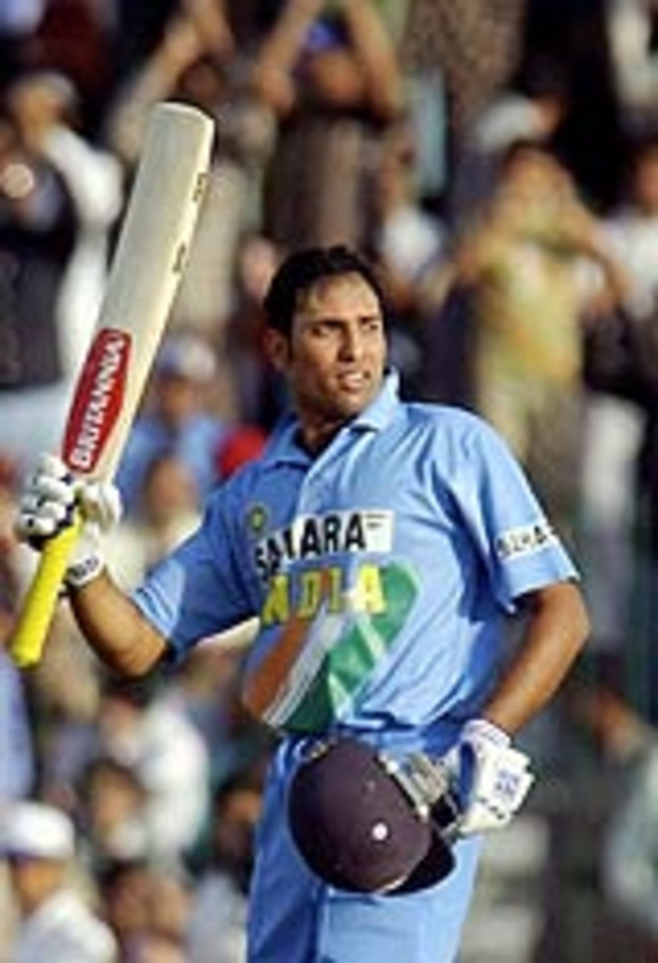 VVS Laxman acknowledges the applause after reaching his century, Pakistan v India, 5th ODI, Lahore, March 24, 2004