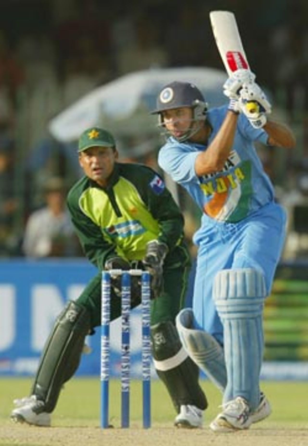 VVS Laxman plays a shot as wicketkeeper Moin Khan looks on