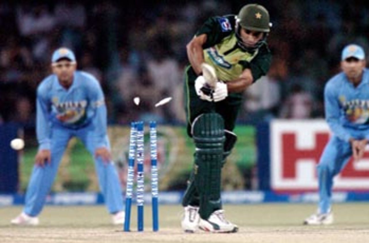 Pakistani batsman Taufeeq Umar is clean bowled by Indian pace bowler Irfan Pathan