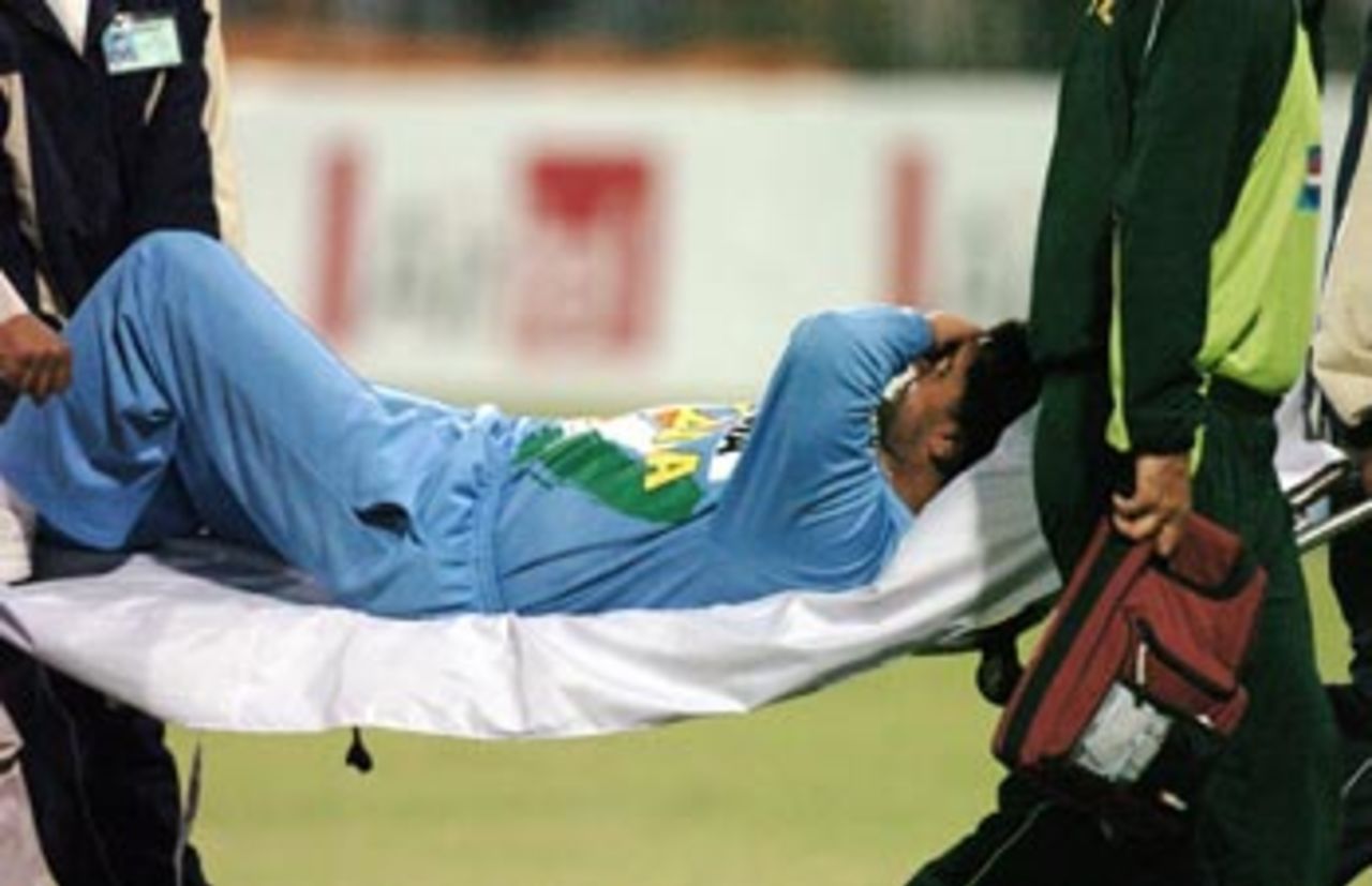 Indian captain Sourav Ganguly is being carrying out of the field on a stretcher after getting injured