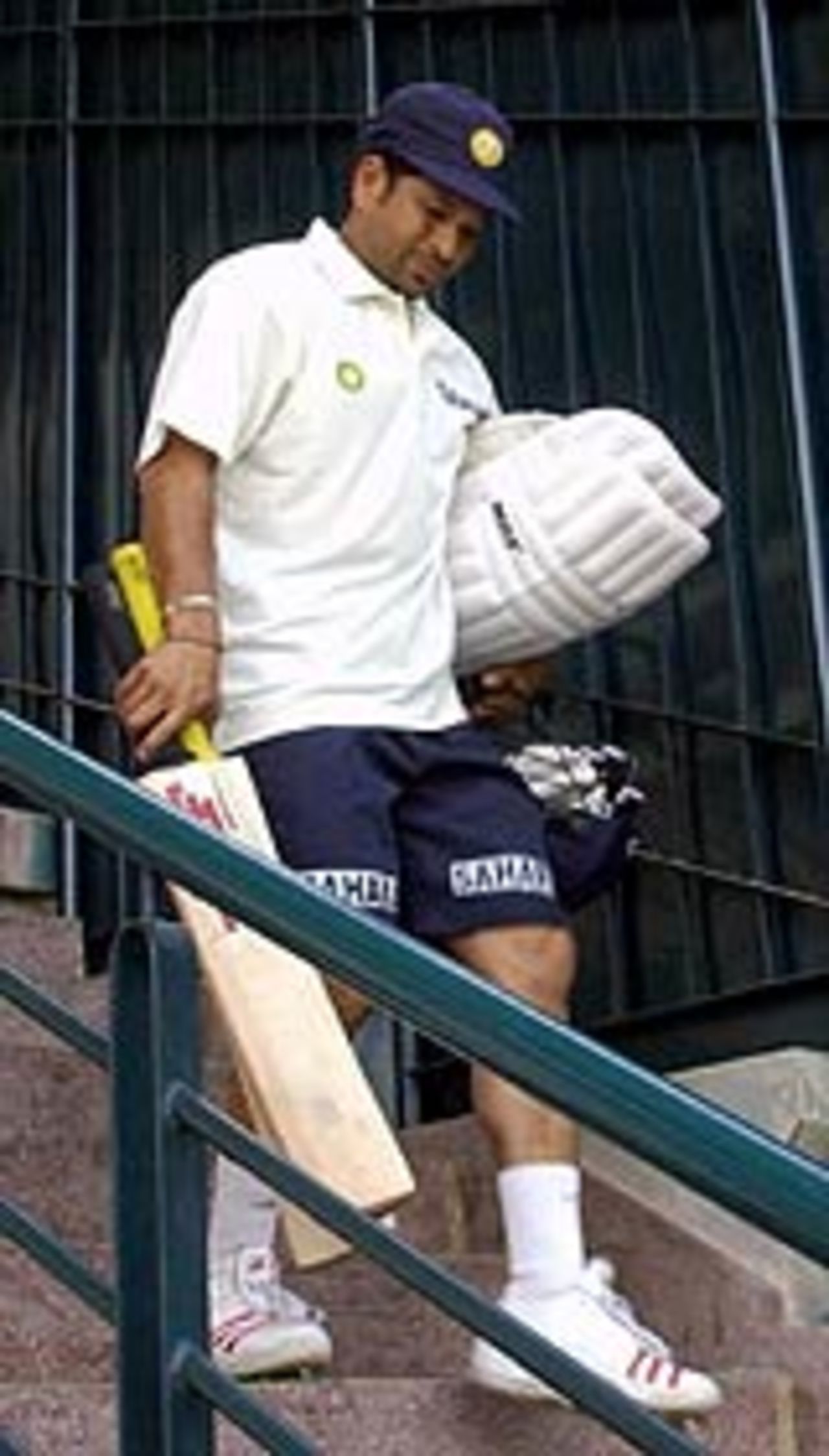 Sachin Tendulkar walking down the stairs, a day before the first Test between India and Pakistan at Multan, March 27, 2004