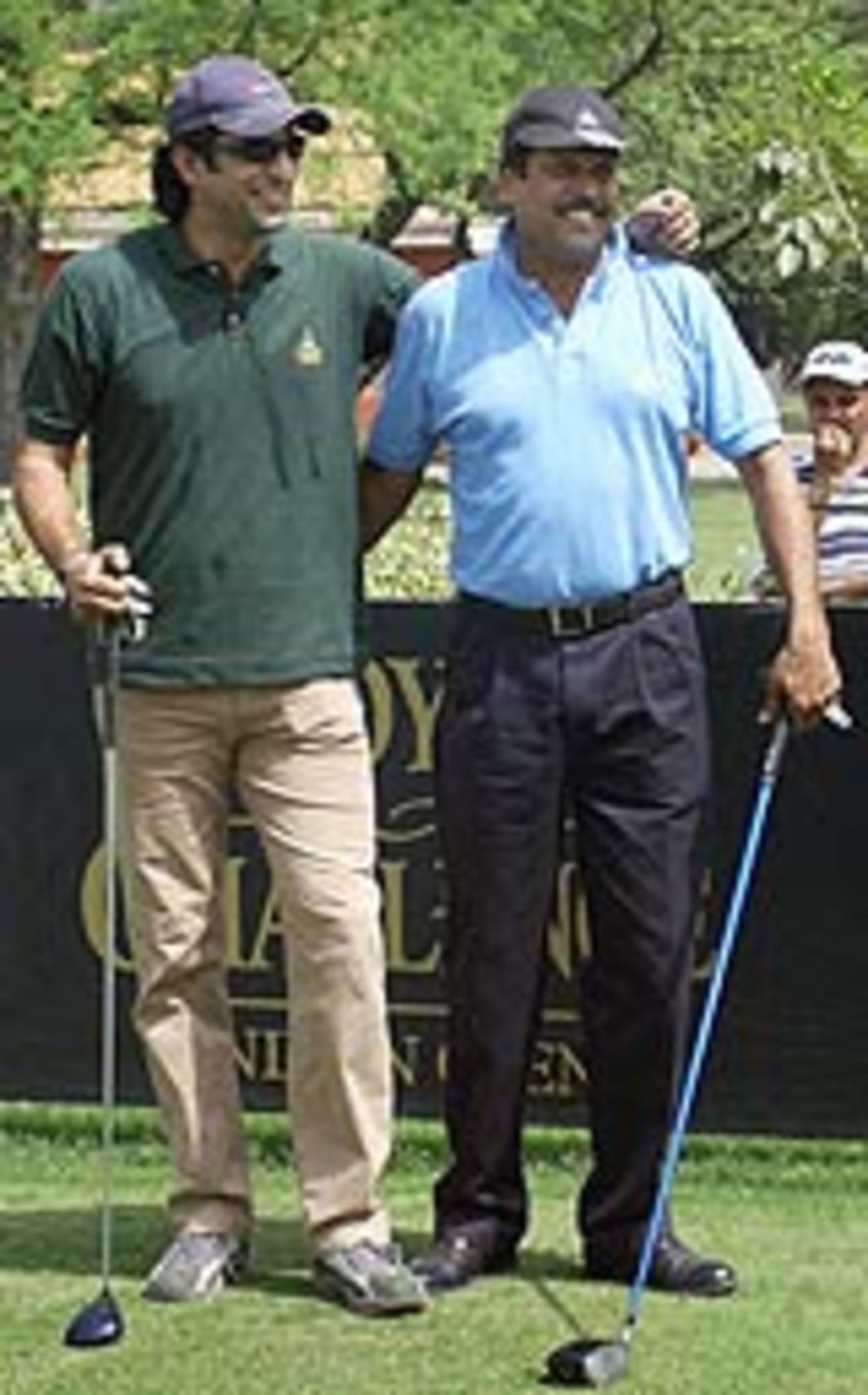 Wasim Akram and Kapil Dev at a golf tournament in New Delhi, March 23, 2004