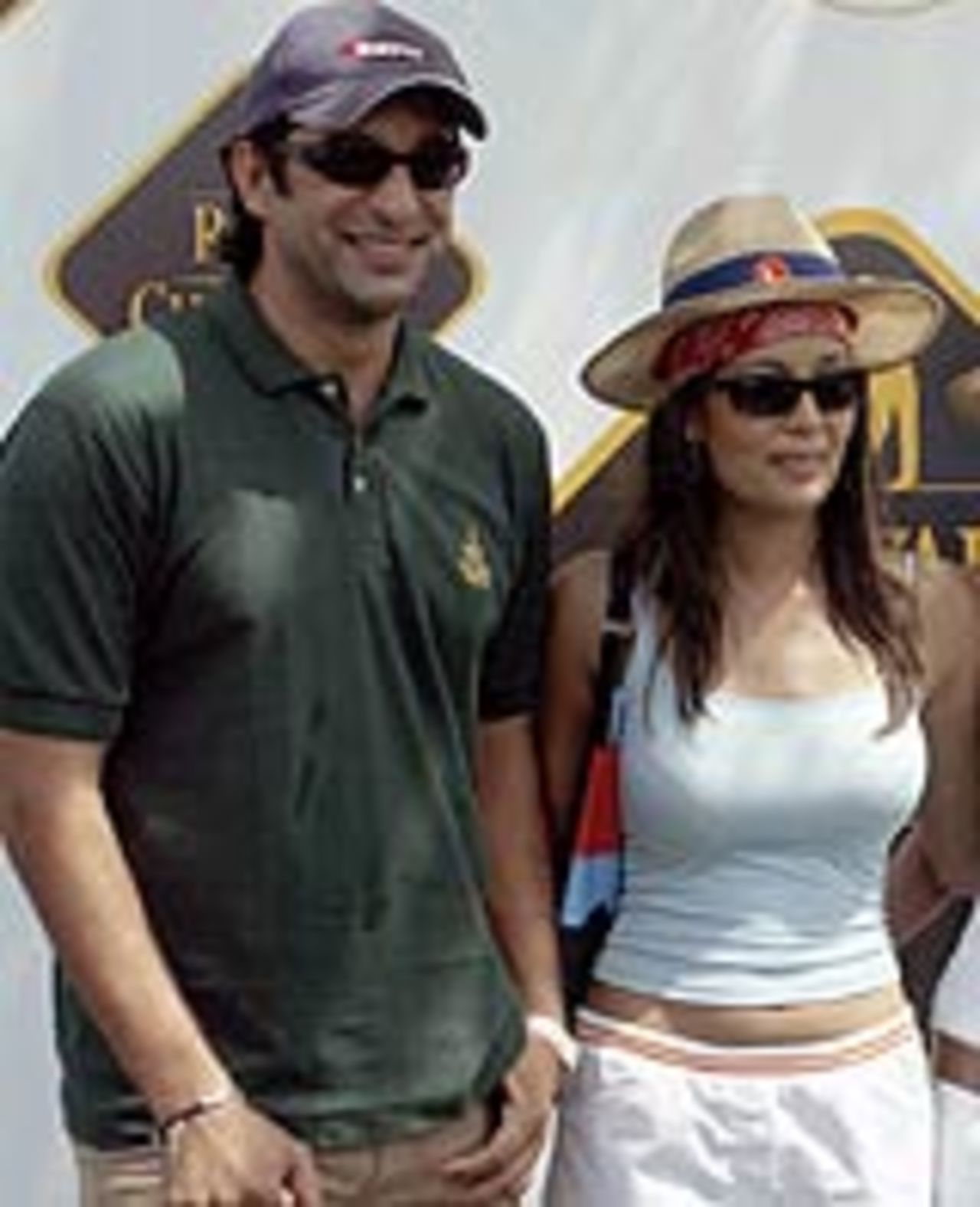 Wasim Akram and Shruti Sharma, an Indian model, at a golf tournament in New Delhi, March 23, 2004