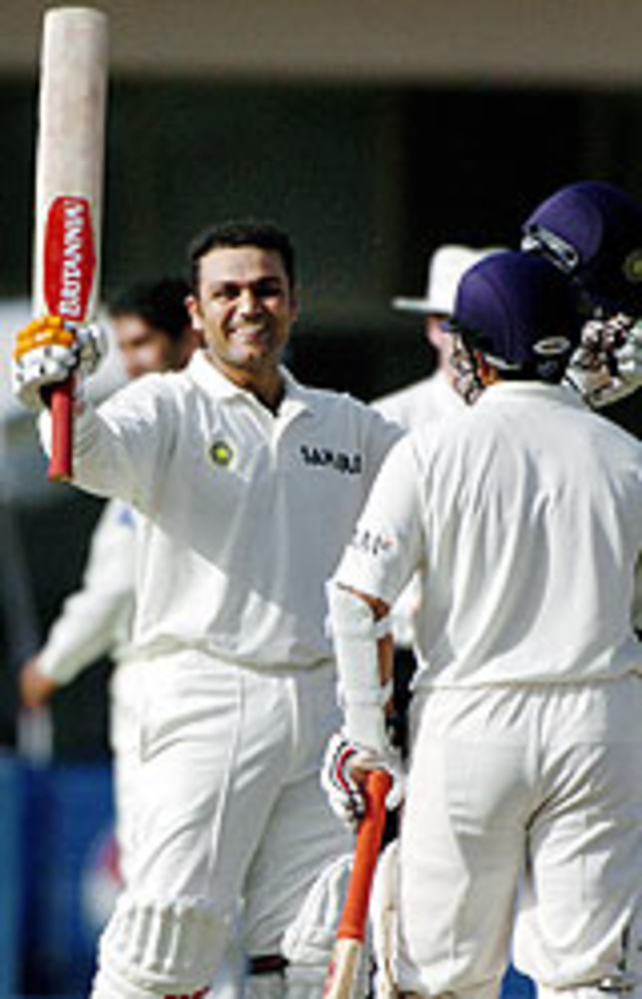 Virender Sehwag raises his bat on reaching 200, Pakistan v India, 1st Test, Multan, 1st day, March 28, 2004