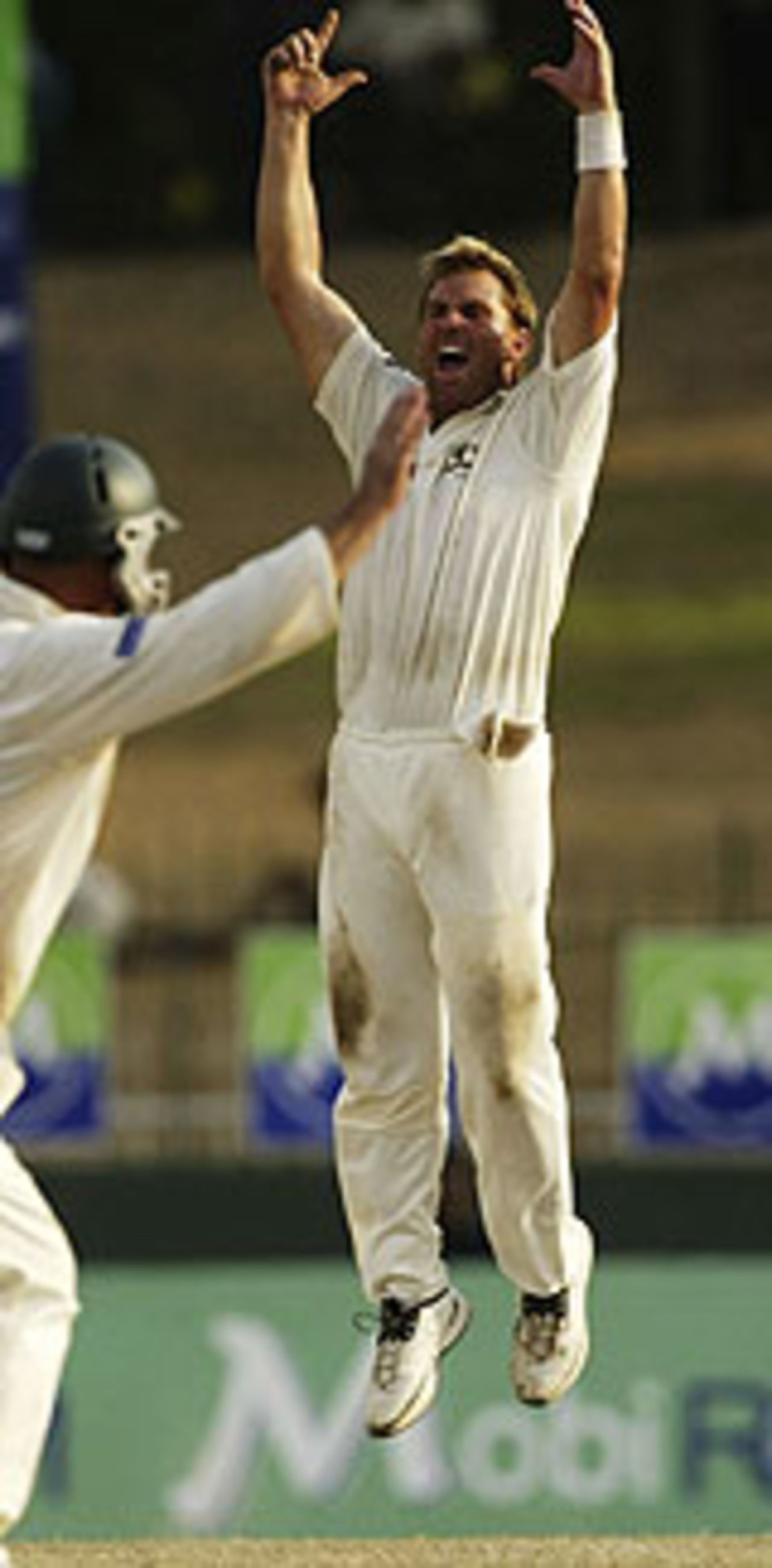 Shane Warne leaps after a wicket, Sri Lanka v Australia, 3rd Test, Colombo, 5th day, March 28, 2004