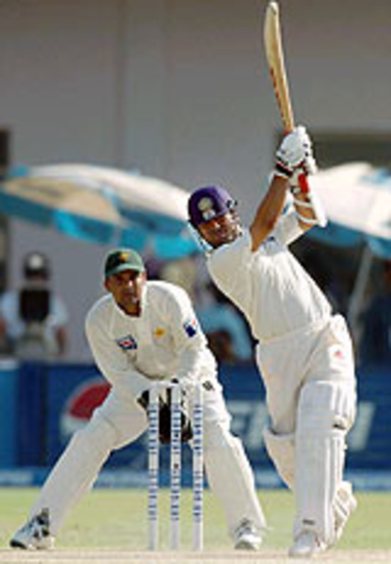 Sachin Tendulkar on the attack, watched by Moin Khan, Pakistan v India, 1st Test, Multan, 2nd day, March 29, 2004