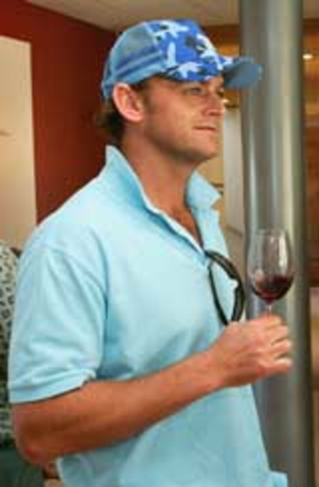 Adam Gilchrist savours a glass of red wine ... and Australia's 4-0 lead against New Zealand, Napier, March 4, 2005