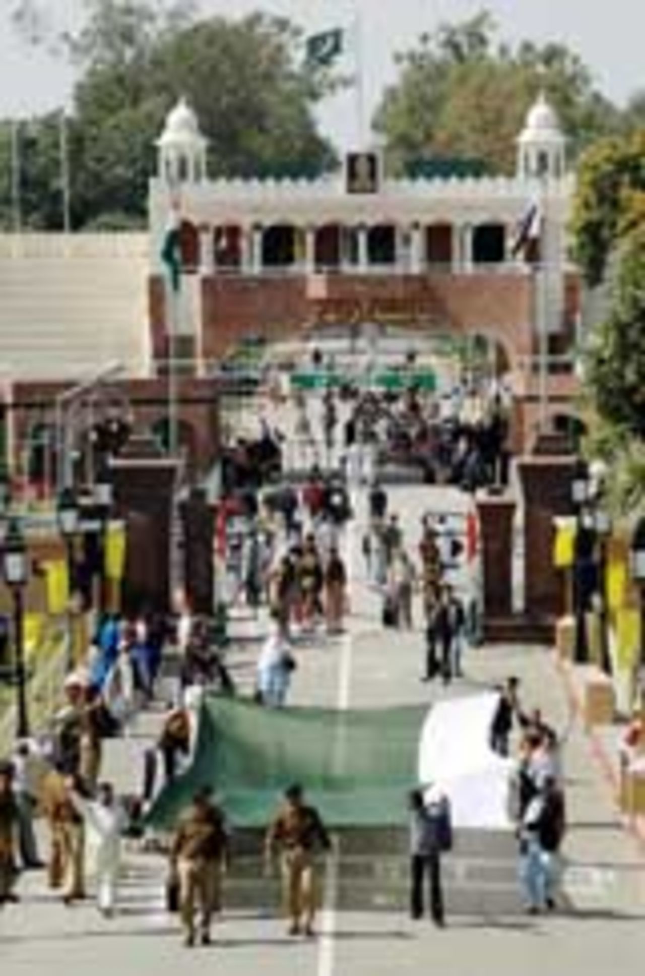Pakistani fans cross the border and walk into India through the gates at Wagah, March 6, 2005