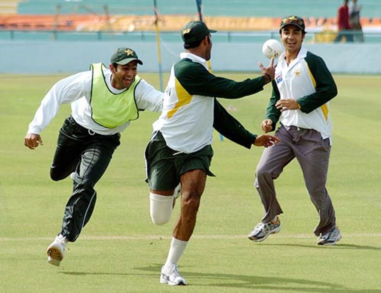 Shoaib Malik, Naved-ul-Hasan and Salman Butt playing rugby ahead of the first Test in Mohali, March 7, 2005