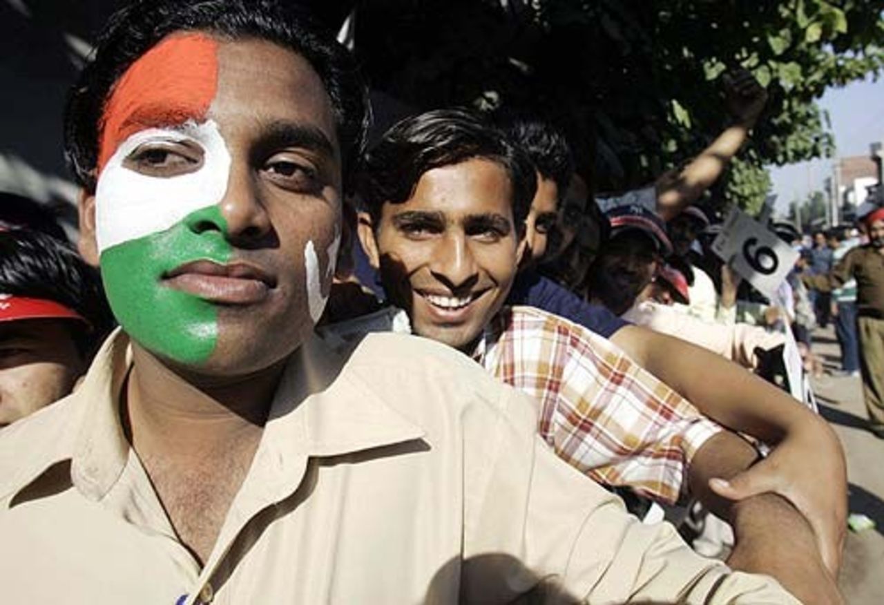A cricket fan wearing the colours of India and Pakistan on his face as he queues outside the Mohali stadium, India v Pakistan, March 8, 2005