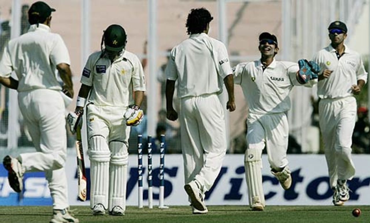 Irfan Pathan being congratulated by his teammates after he got an early wicket of Salman Butt in Mohali, India v Pakistan, March 8, 2005