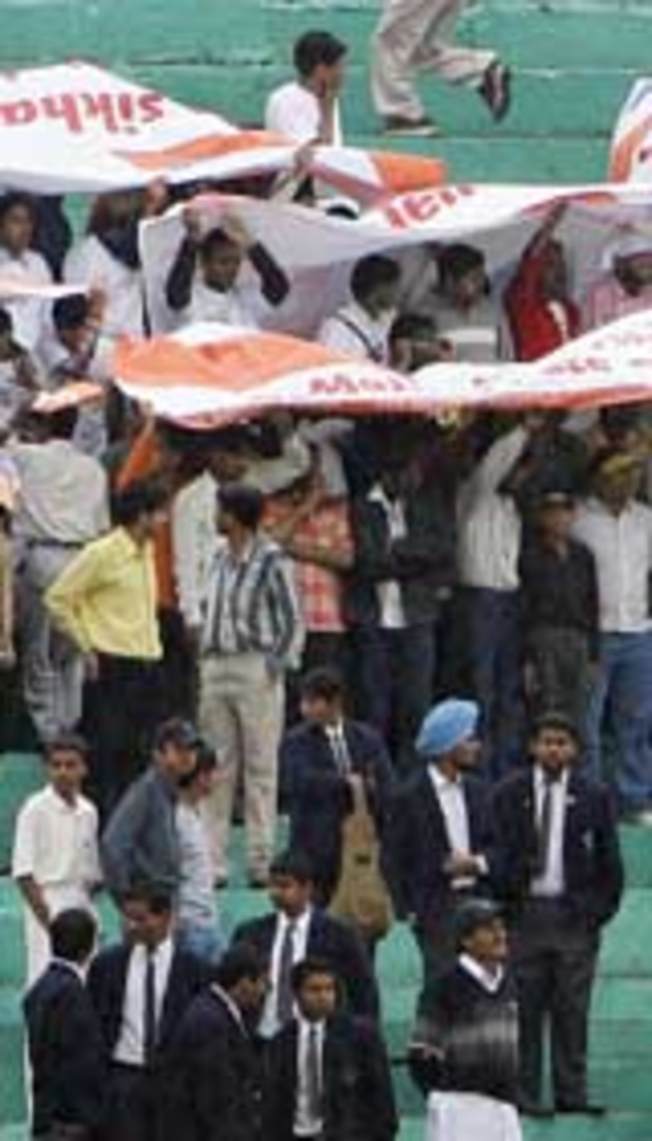 Fans wait patiently for play to get under way, India v Pakistan, 1st Test, Mohali, March 9, 2005