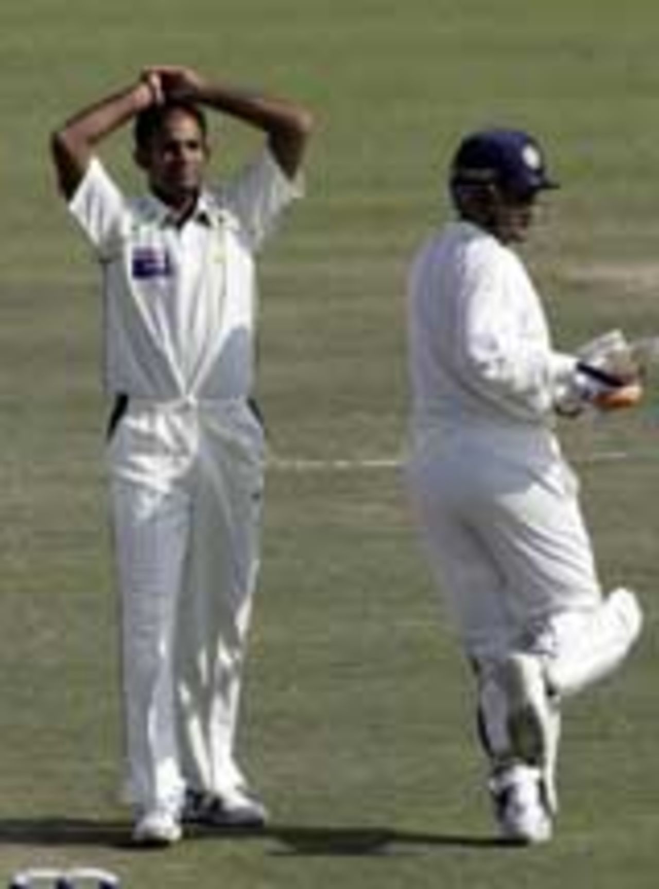 Naved-ul-Hasan despairs as Virender Sehwag slaps the ball to the fence, India v Pakistan, 1st Test, Mohali, March 10, 2005