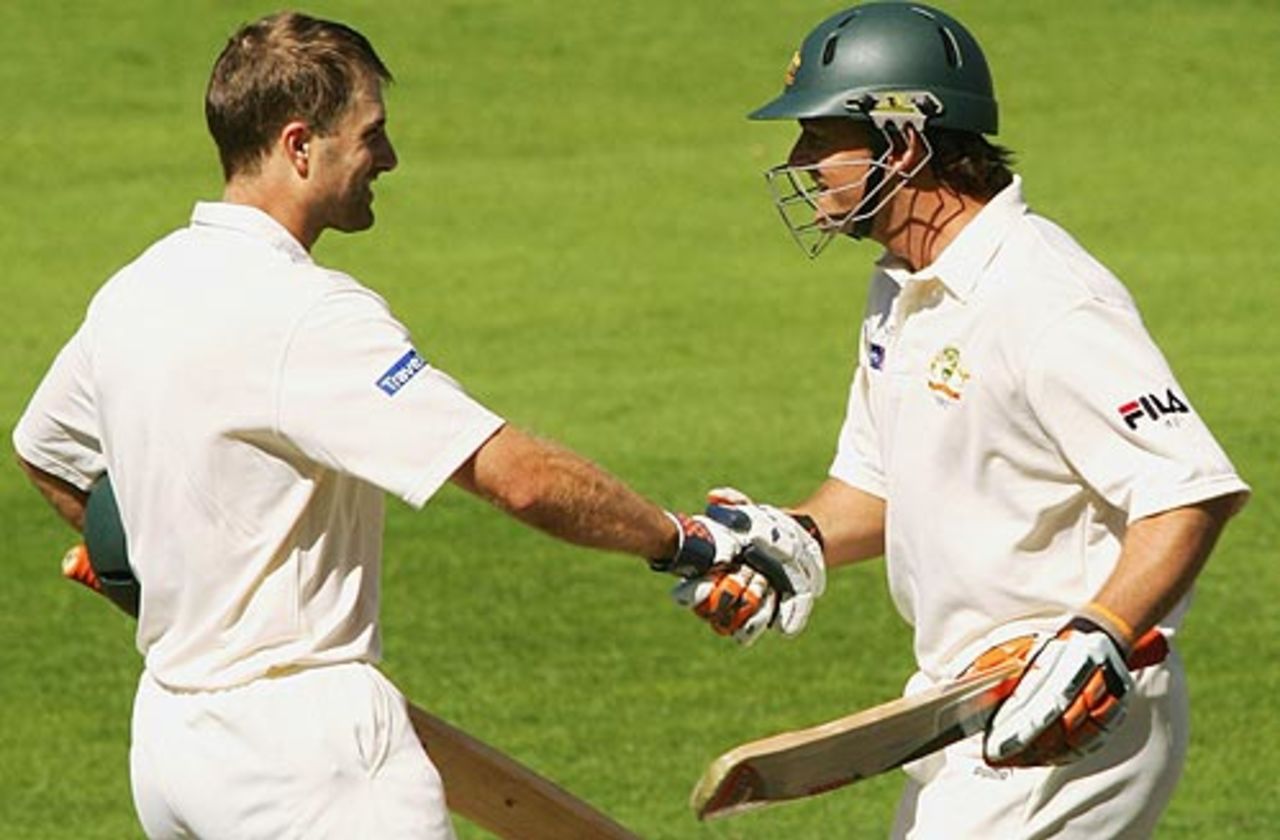 Simon Katich shakes hands with Adam Gilchrist after reaching his hundred, New Zealand v Australia, 1st Test, Christchurch, March 12, 2005
