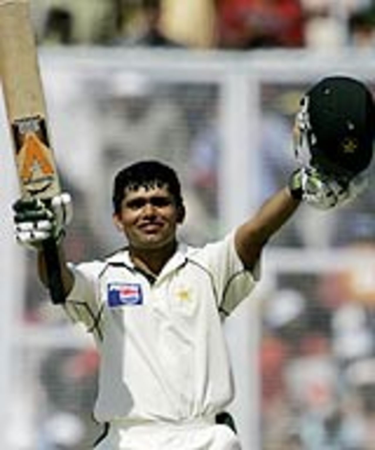 Kamran Akmal celebrates his maiden century, India v Pakistan, 1st Test, Mohali, 5th day, March 12, 2005