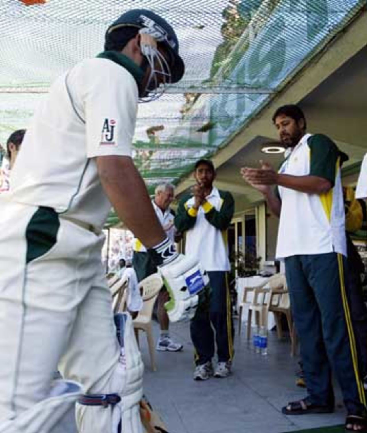 Kamran Akmal had done his bit, and the whole Pakistan team was on the dressing-room steps, appluading, as he walked back in, India v Pakistan, 1st Test, Mohali, 5th day, March 12, 2005