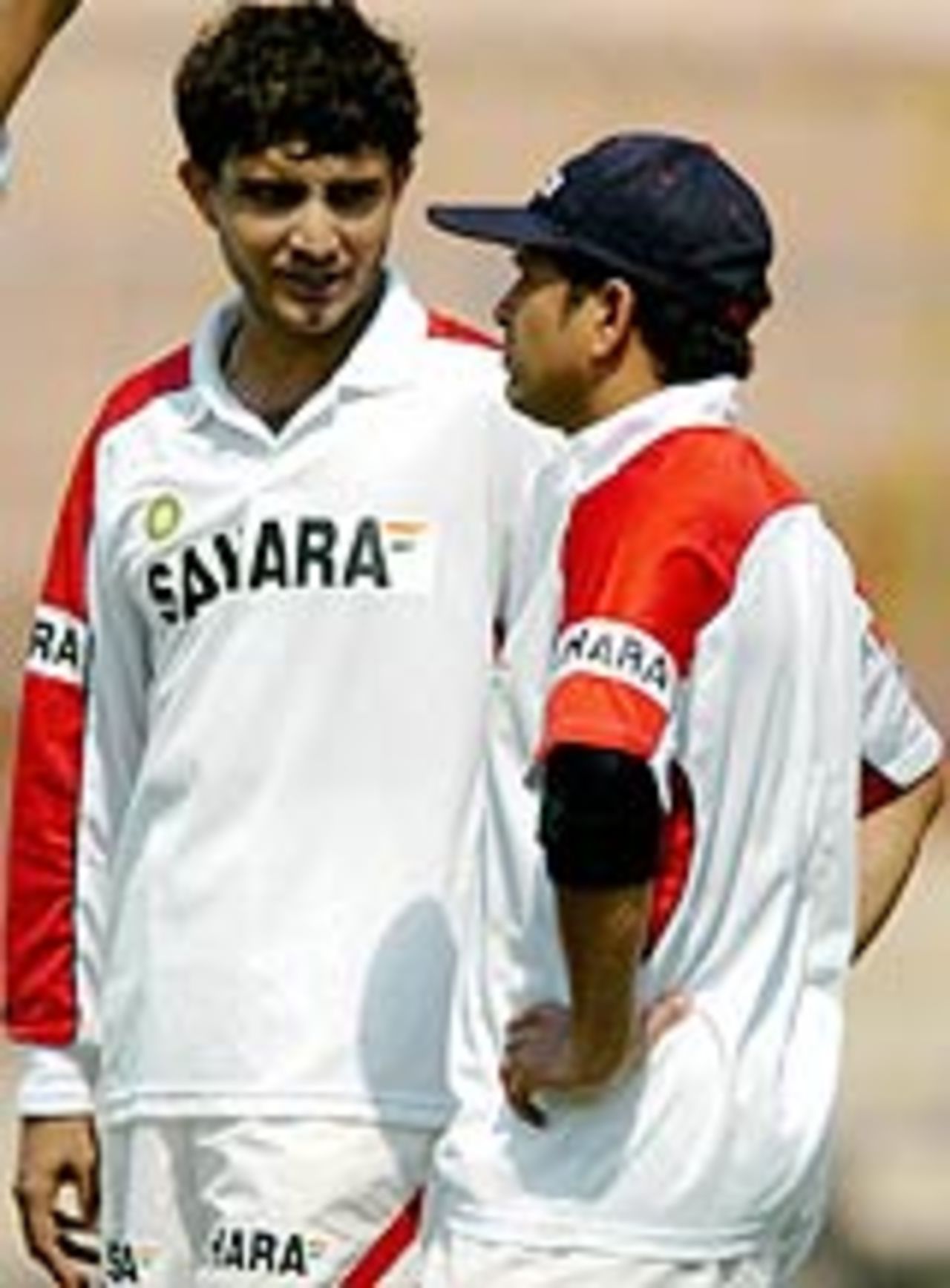 Sourav Ganguly speaks with Sachin Tendulkar during a practice session, Kolkata, March 15, 2005