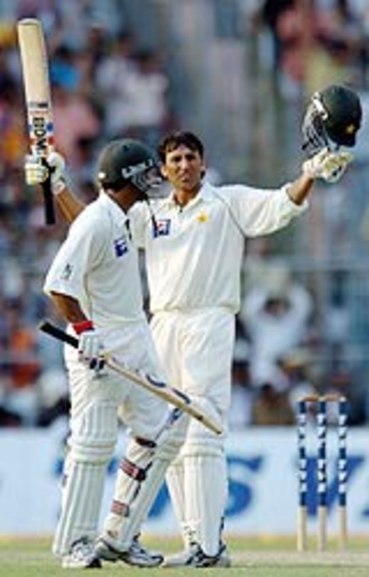 Younis Khan being congratulated by Yousuf Youhana on completing his ton, India v Pakistan, 2nd Test, Kolkata, March 17, 2005