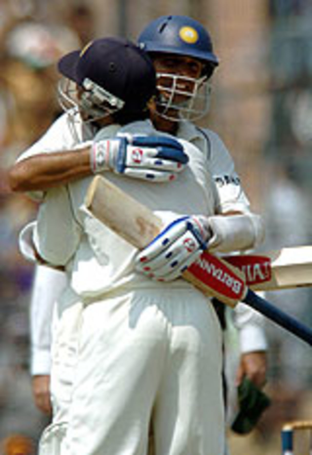 Rahul Dravid and Dinesh Karthik hug after Dravid's second hundred of the game, India v Pakistan, 2nd Test, Kolkata, March 19, 2005