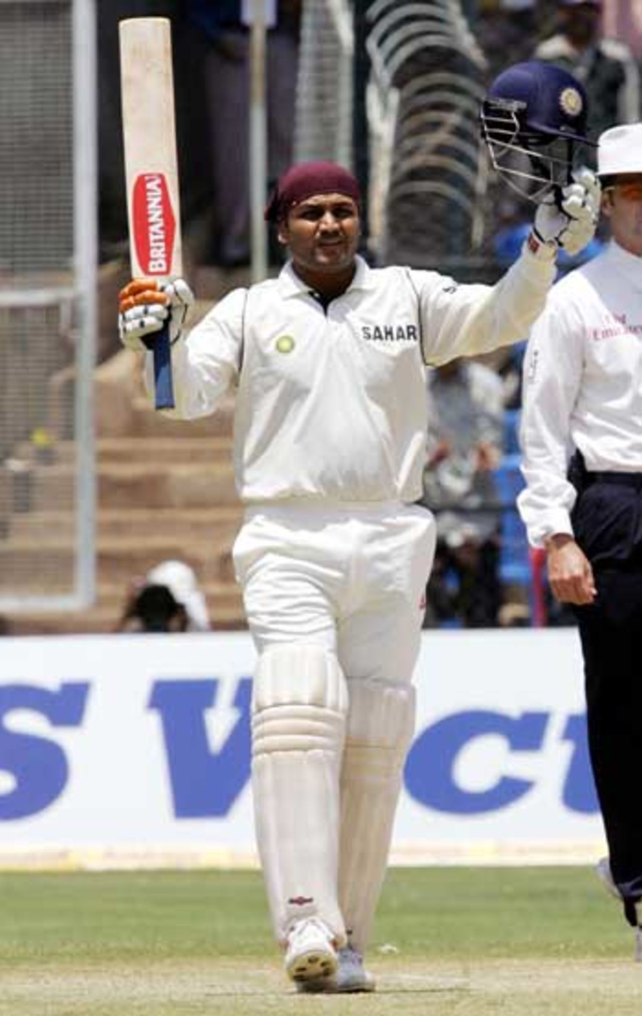 Virender Sehwag raises his bat to the crowd after reaching his century, India v Pakistan, 3rd Test, Bangalore, 3rd day, March 24, 2005