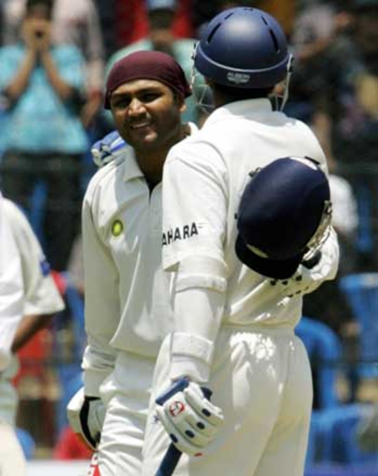 Virender Sehwag got a warm hug when he went past yet another milestone and kept Pakistan at bay, India v Pakistan, 3rd Test, Bangalore, 3rd day, March 24, 2005