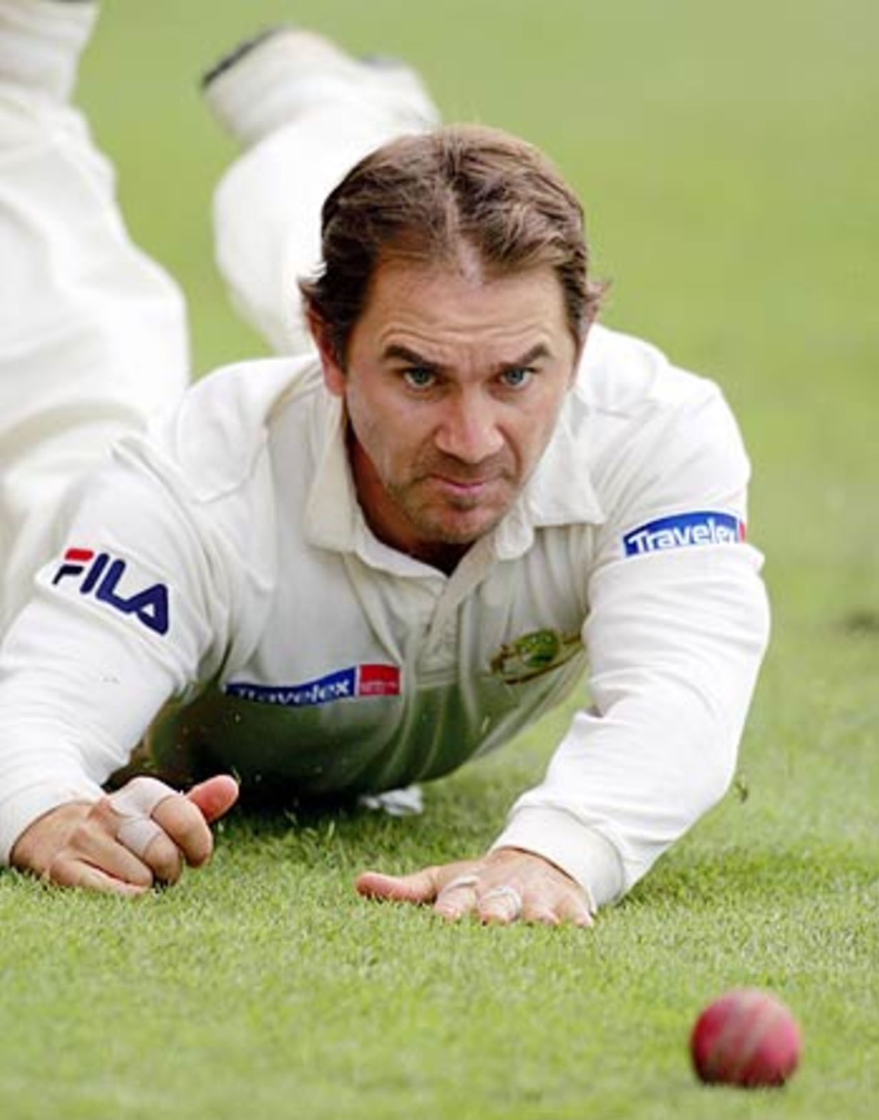 Justin Langer makes a desperate dive to stop a boundary, New Zealand v Australia, 3rd Test, Auckland, 4th day, March 29, 2005