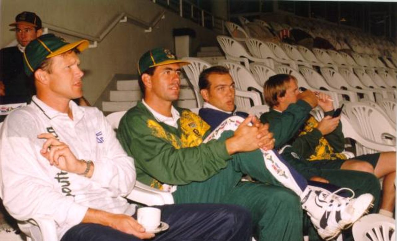 Standard Bank tournament final, abandoned game on 22 April 1998 at Newlands, Cape Town SA. Corrie van Zyl (Fitness Coach), Hansie Cronje (Captain), Jacques Kallis and Mike Rindel relaxing at Newlands while waiting for the rain to stop.