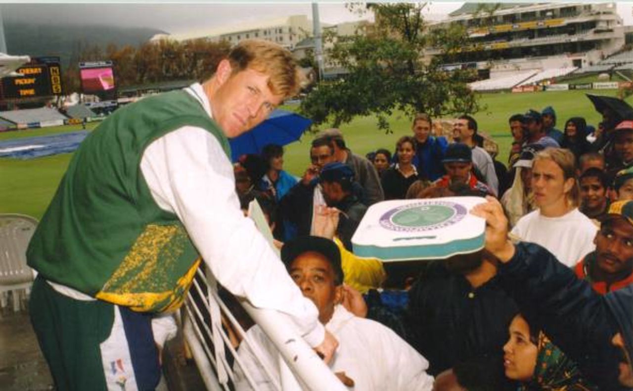 Jonty Rhodes signing autographs Standard Bank tournament final, abandoned game on 22 April 1998 at Newlands, Cape Town SA.