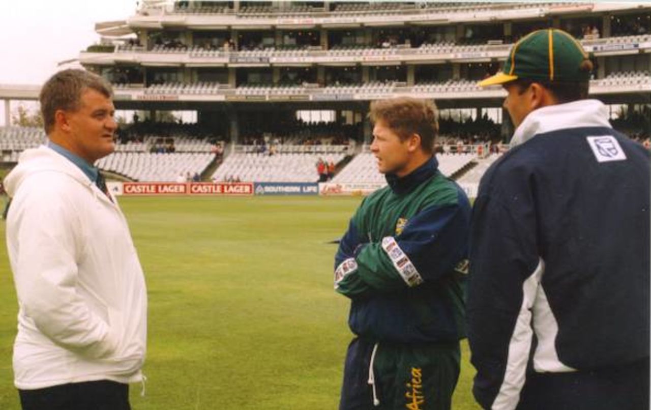 Groundsman Christo Erasmus with Darryl Cullinan and Hansie Cronje. Standard Bank tournament final, abandoned game on 22 April 1998 at Newlands, Cape Town SA.