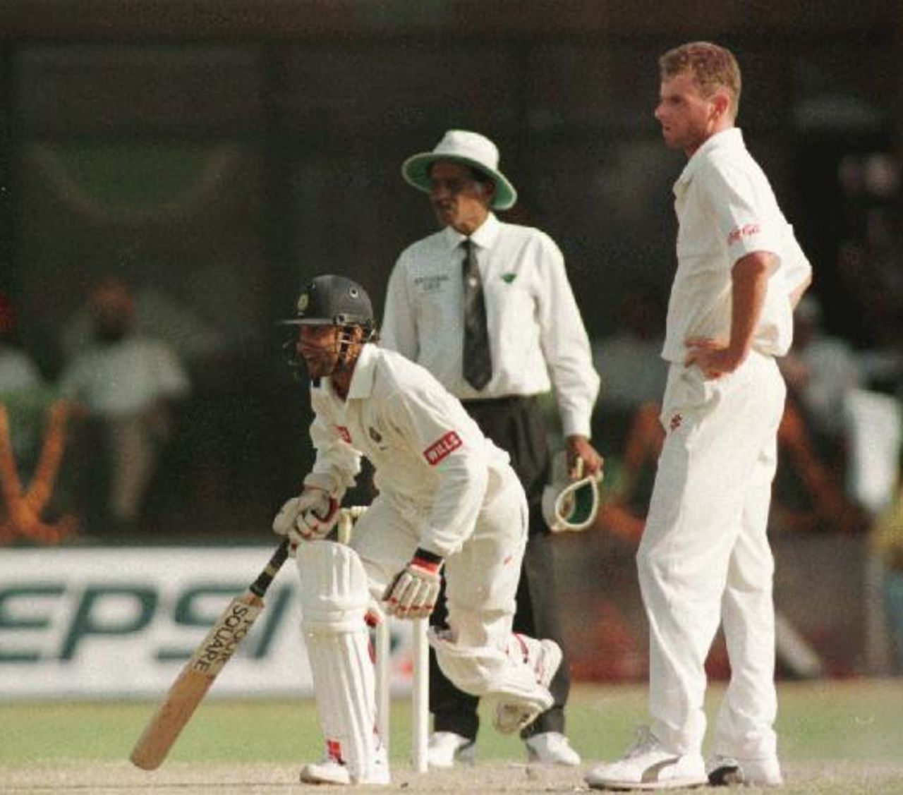 Paul Reiffel and umpire Venkataraghavan look on as India take some runs on day 2 of the 1996-97 India vs Australia test at New Delhi