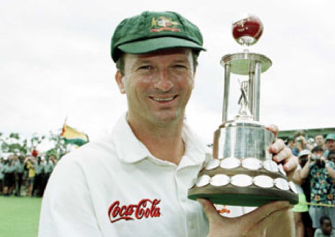 Steve Waugh holds up the Frank Worrell Trophy after Australia won the fourth Test to level the series 2-all and retain the trophy. April 7, 1999.