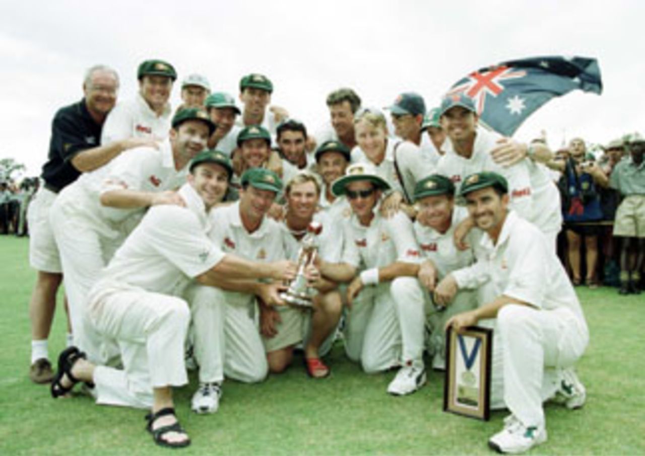 The Australian Team poses with the Sir Frank Worrell trophy after their fourth test win to level the series 2-all and retain the trophy. April 7, 1999.