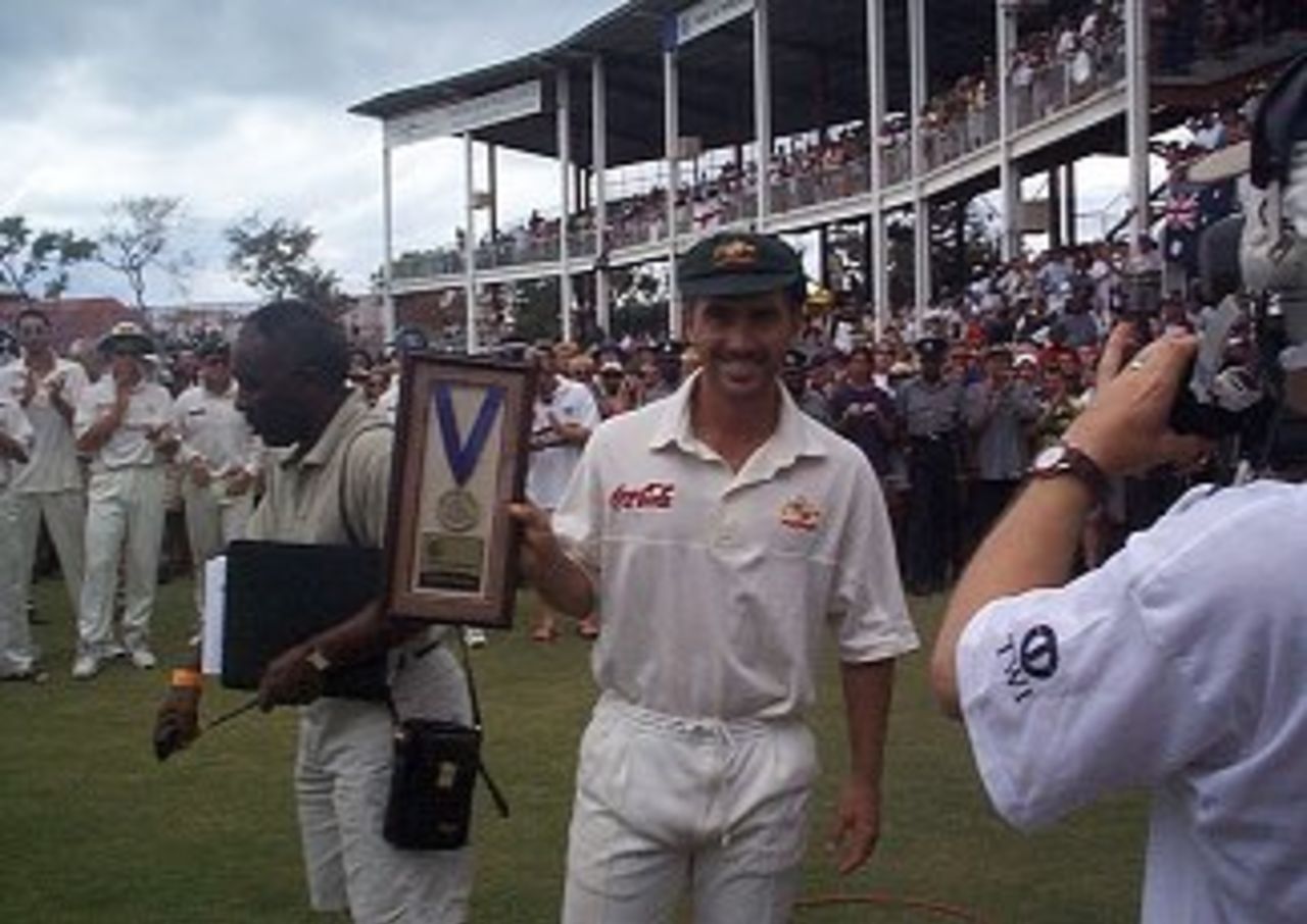 Justin Langer is applauded by the Antiguan crowd after winning the Man of the Match award in the fourth and final Test against the West Indies. April 7, 1999.