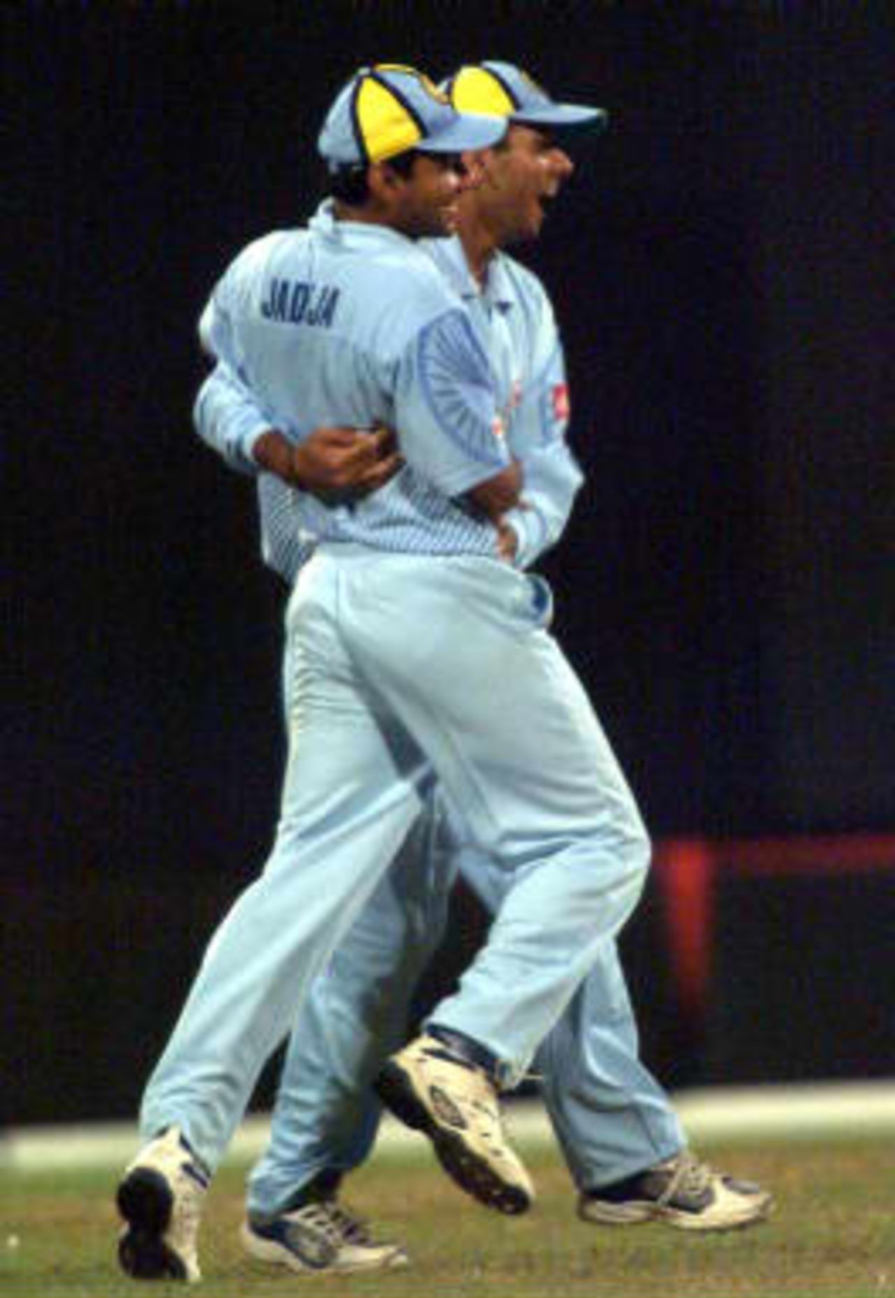 Indians Ajay Jadeja and Rahul Dravid celebrate the run-out of Ian Austin in the 3rd match of the Coca Cola Championships being played in Sharjah on 9th April 1999