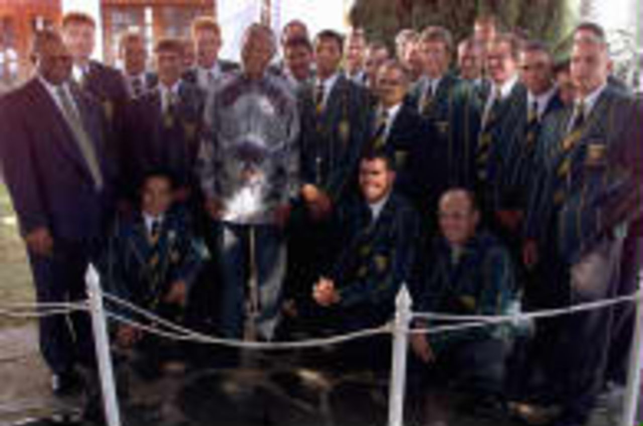 South African President Nelson Mandela and Sports Minister Steve Tshwete pose on 15 April 1999 with the South African cricket team outside Mandela's official residence in Pretoria. Mandela hosted a lunch for the national cricket team to boost their moral before the upcoming Cricket World Cup in Great Britain.