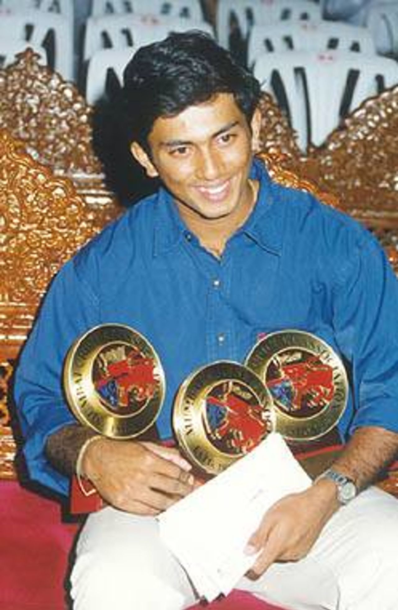 Amit Pagnis with his 3 junior-cricketer-of-the-year prizes.