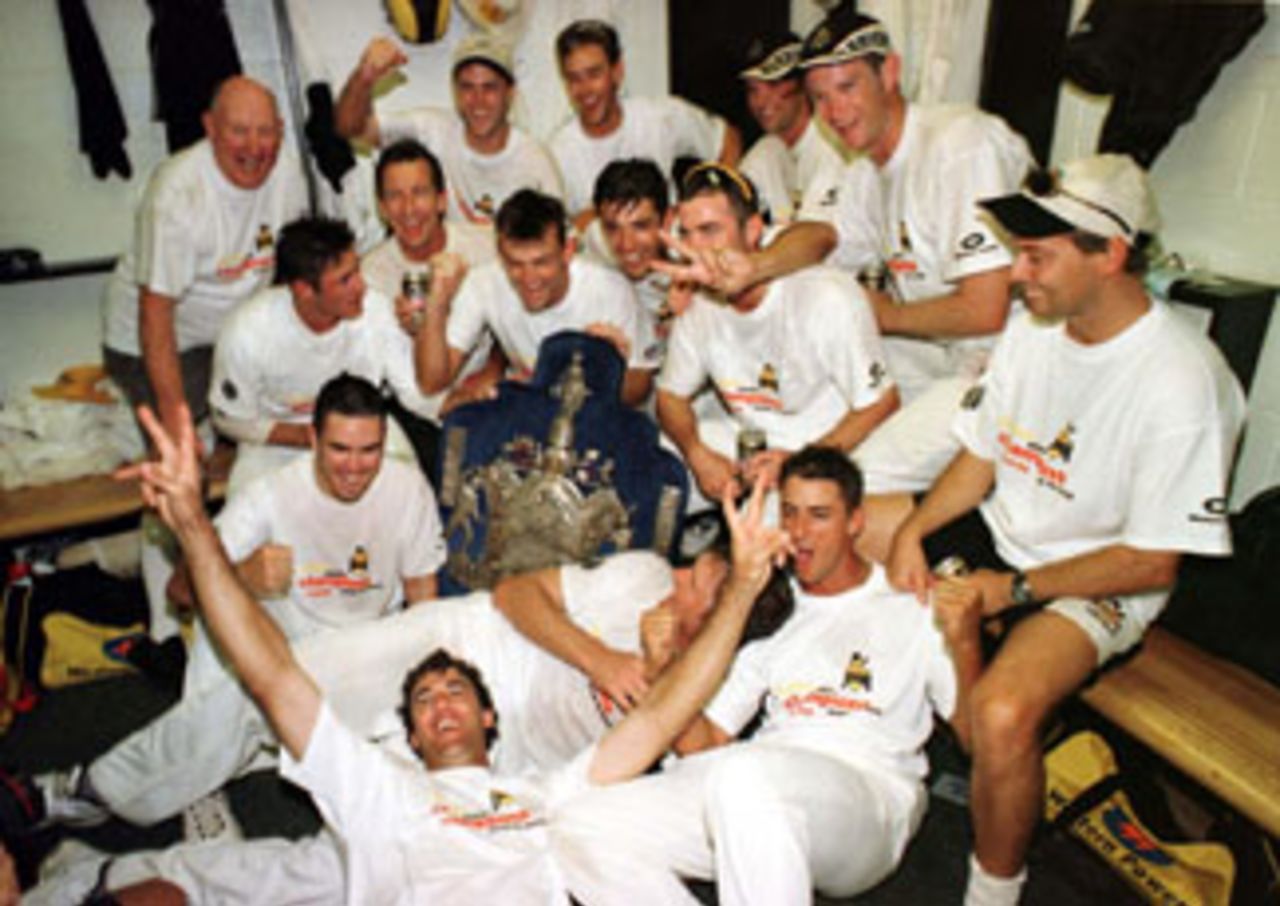 The Western Australian team with the Sheffield Shield after they defeated Queensland in the final, 1998/99