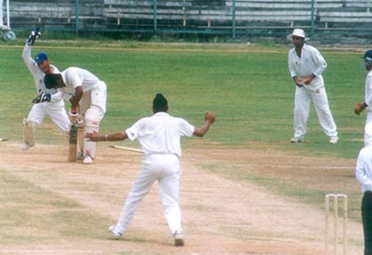 Harbhajan Singh knocks two stumps out of the ground to despatch Sadagopan Mahesh for a first ball duck, Tamil Nadu v Punjab (Day 3), Ranji Trophy Quarter Final 2, MA Chidambaram Stadium Chepauk, Chennai, 30 Mar-3 Apr 2000.