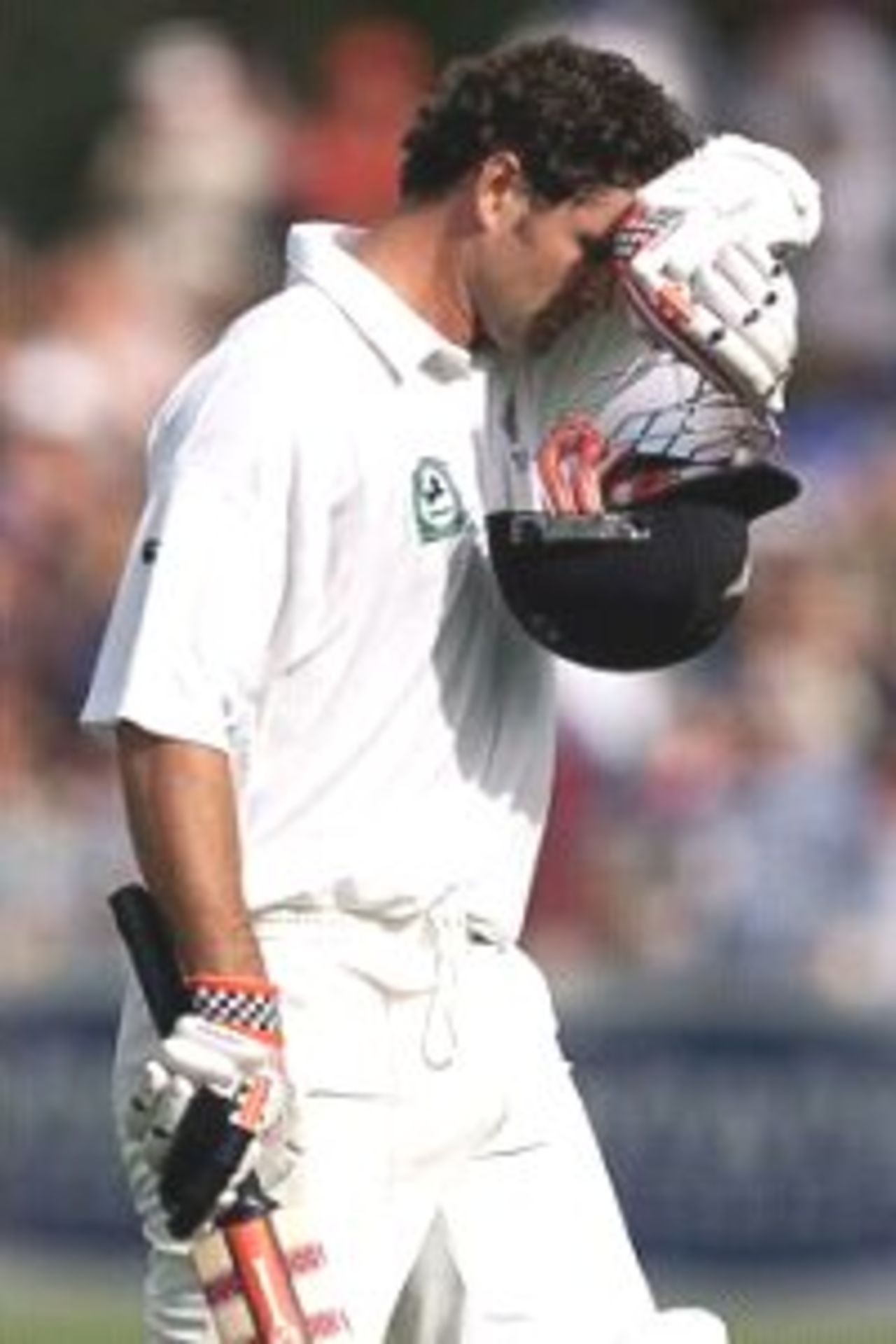 02 Apr 2000: A disappointed Chris Cairns of New Zealand leaves the field out for 71, during day three of the third test between New Zealand and Australia, at WestpacTrust Park, Hamilton, New Zealand.