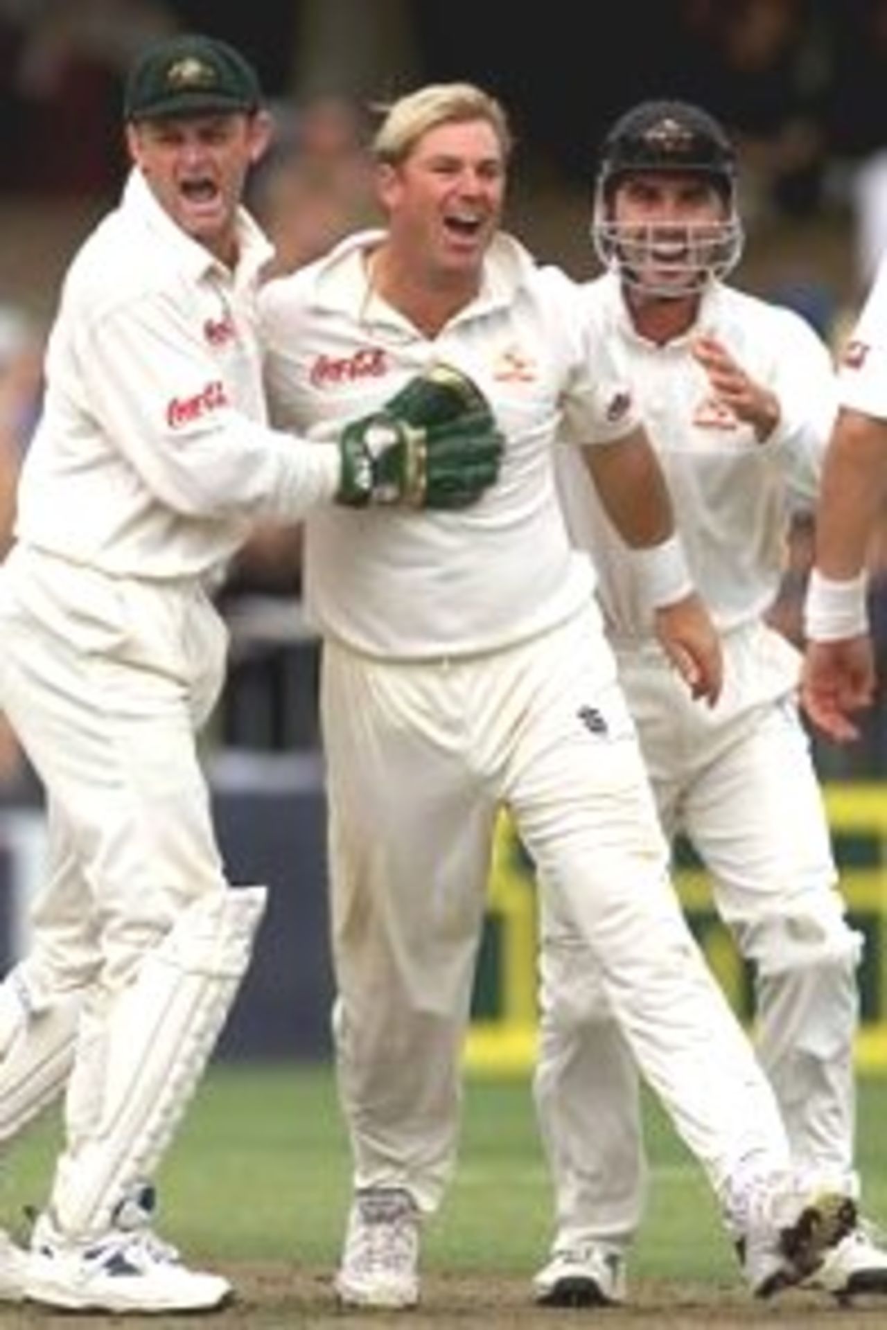 02 Apr 2000: Shane Warne of Australia celebrates with Adam Gilchrist after Gilchrist caught Craig McMillan of New Zealand off Warne's bowling during day three of the third test between New Zealand and Australia, at WestpacTrust Park, Hamilton, New Zealand.