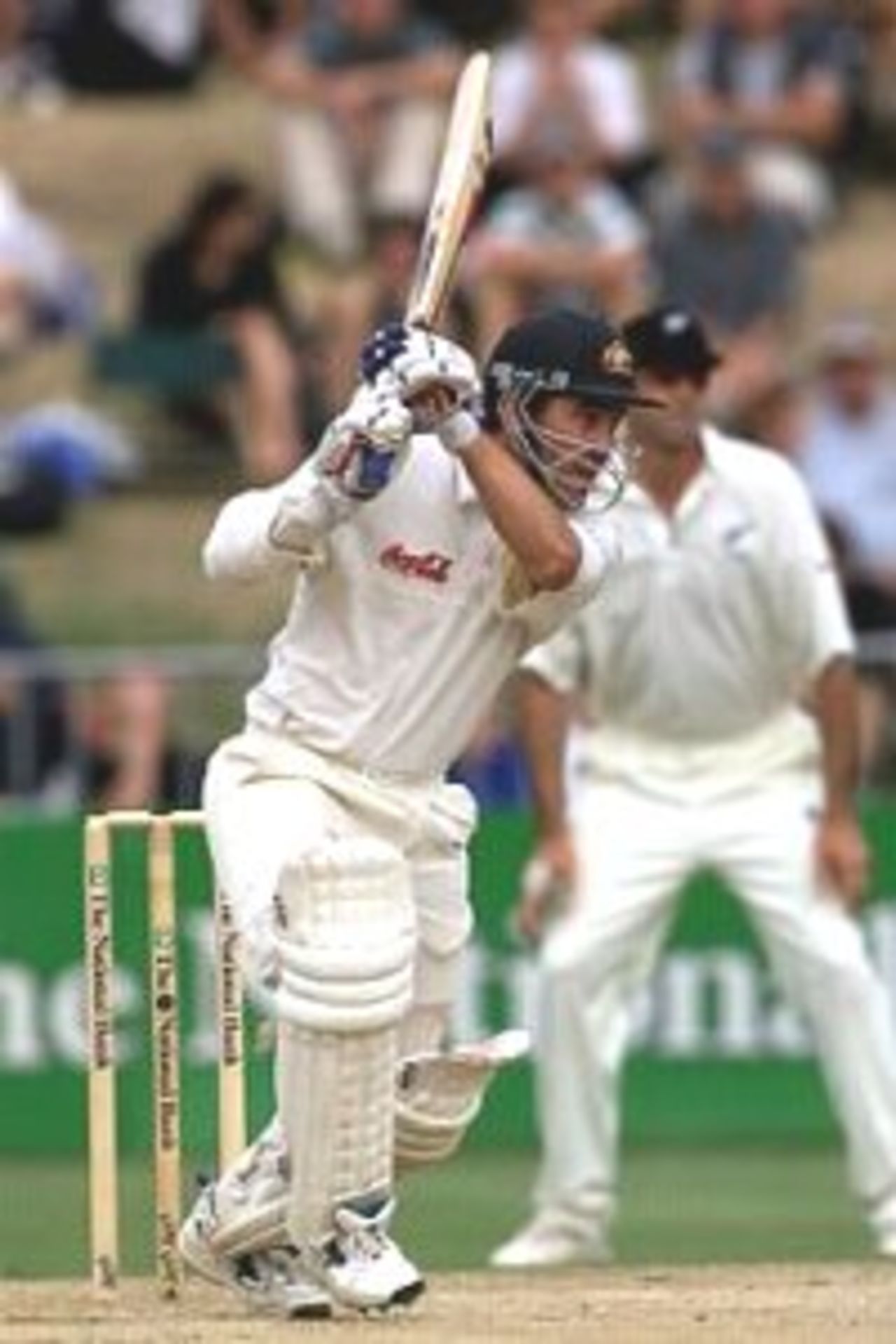 02 Apr 2000: Justin Langer of Australia drives on his way to a half century off only 42 deliveries, an Australian record, during day three of the third test between New Zealand and Australia, at WestpacTrust Park, Hamilton, New Zealand.