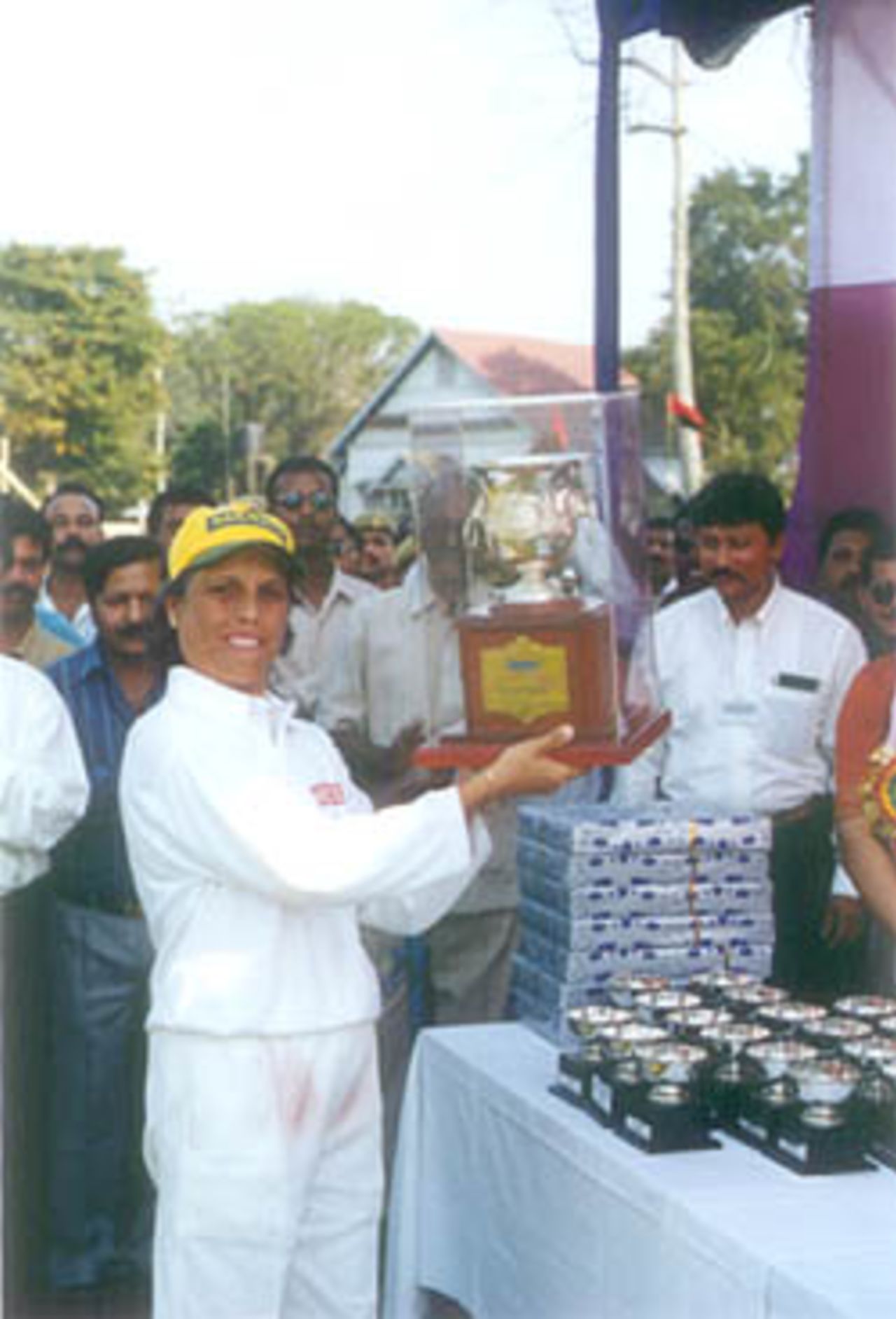The captain of the Railways team, Diana Edluji, holds up the CricInfo Trophy, Air India v Indian Railways Senior Womens National Cricket Championship, 2000 (Final), Jorhat Stadium, 25-27 March 2000.