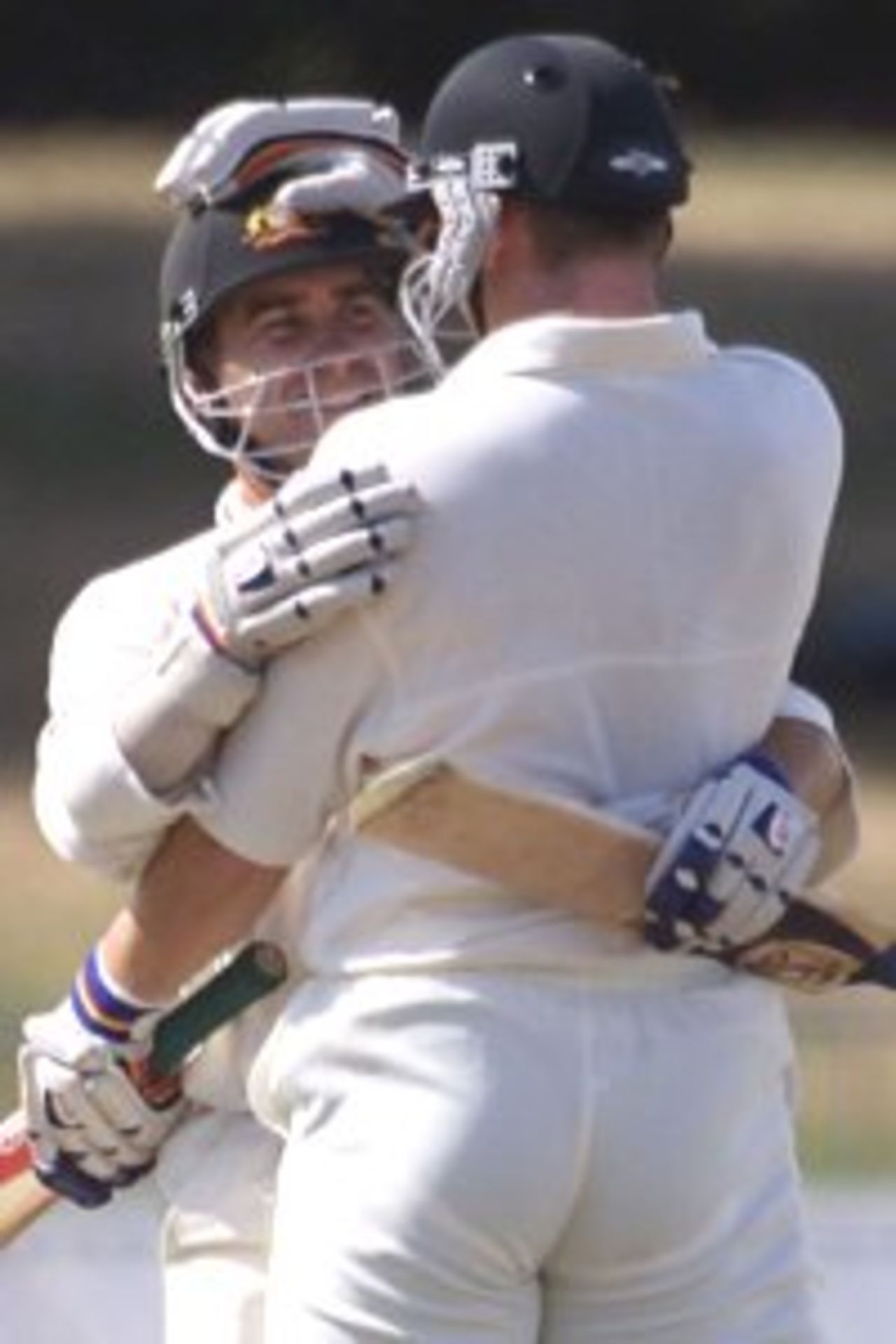 03 Apr 2000: Justin Langer of Australia hugs team mate Adam Gilchrist as Australia wins the test, during day four of the third test between New Zealand and Australia, at WestpacTrust Park, Hamilton, New Zealand. Australia won by six wickets.