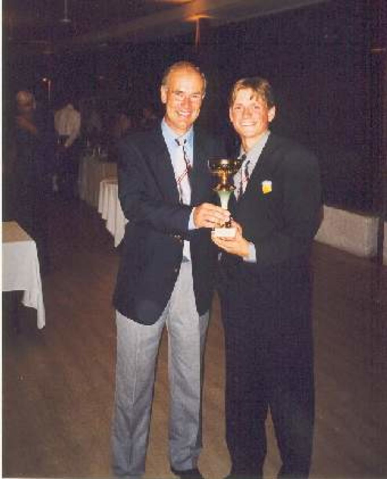 Ralph Dellor (Austrian Coaching Advisor) congratulates Benjamin Loader on being made Bowler of the Tournament