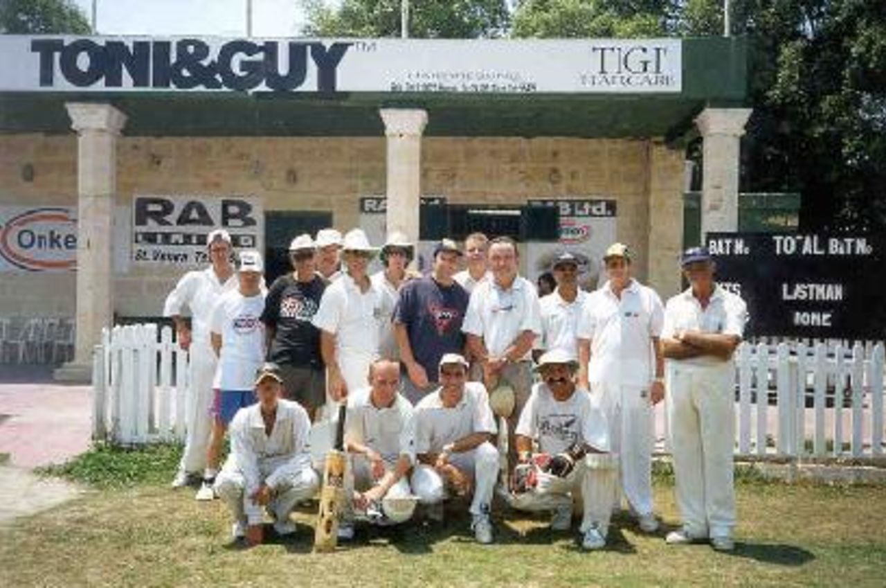 Former Australian captain and coach Bob Simpson with members of the Marsa Sports Club Team - July 1999