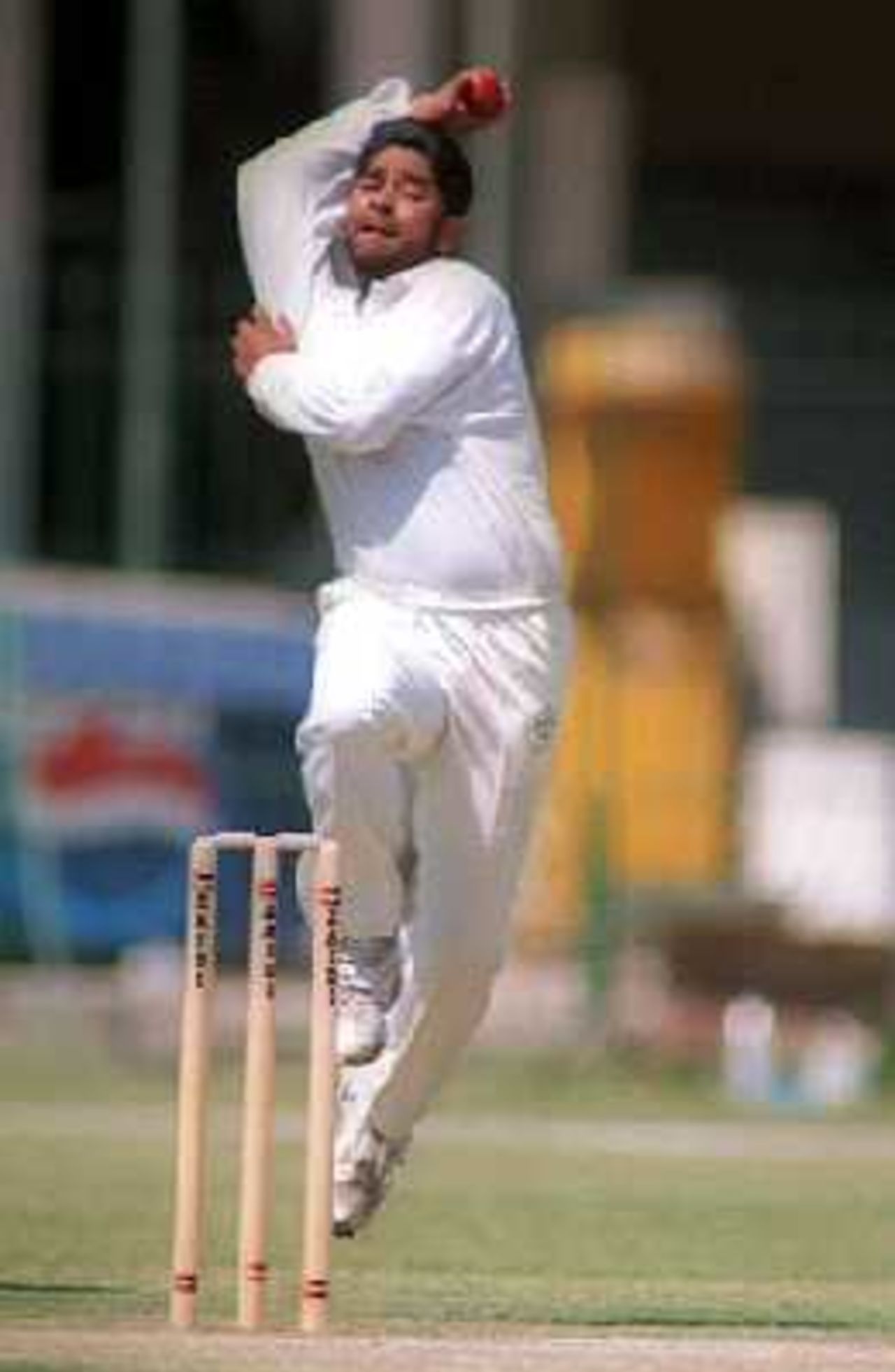 NBP's Athar Laeeq bowls during the final round match against Habib Bank at the Gaddafi Stadium, Lahore. 6 April 2000.